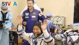 Spaceflight participant Yusaku Maezawa of Japan, member of the main crew of the new Soyuz mission to the International Space Station (ISS) gestures prior the launch at the Russian leased Baikonur cosmodrome, Kazakhstan, Wednesday, Dec. 8, 2021. (Pavel Kas