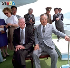Kim Il Sung sits alongside former U.S. President Jimmy Carter in June 1994, just weeks before Kim's death. Their talks in Pyongyang helped broker a U.S.-DPRK nuclear deal, but the accord fell apart in 2002.