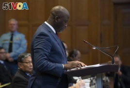 Gambia's Justice Minister Aboubacarr Tambadou addresses judges of the International Court of Justice for the first day of three days of hearings in The Hague, Netherlands, Tuesday, Dec. 10, 2019.