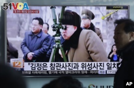 A man passes by a TV screen showing North Korean leader Kim Jong Un during a news program at Seoul Railway Station in Seoul, South Korea, Thursday, March 24, 2016.