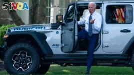 President Joe Biden gets out of a Jeep Wrangler Rubicon 4xE on the South Lawn of the White House in Washington, Aug. 5, 2021.