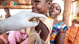 FILE - A child is given a measles vaccination during an emergency campaign run by Doctors Without Borders (MSF) in Likasa, Mongala province in northern Democratic Republic of Congo.