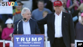 FILE - Then Republican presidential candidate Donald Trump (R) stands next to Senator Jeff Sessions during a rally in Madison, Alabama, Feb. 28, 2016. Sessions is a possible candidate for secretary of defense.