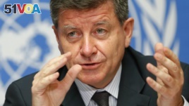 FILE - Guy Ryder, Director-General of the International Labor Organization (ILO) gestures during a news conference at the United Nations European headquarters in Geneva, May 26, 2014. 