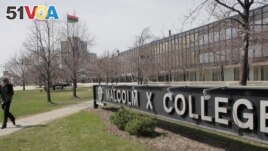 A student walks across campus at Malcom X College, Thursday, April 1, 2010, in Chicago. (AP Photo/M. Spencer Green)