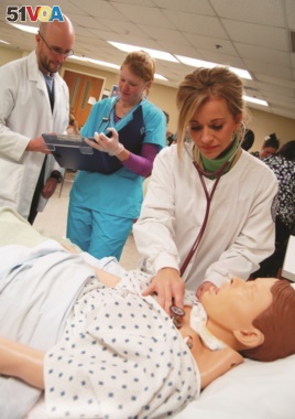 Nursing students practice on a model patient at Roane State Community College in Oak Ridge, Tennesee