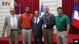 French President Francoise Hollande awarded the Legion of Honor medal on U.S. Airman Spencer Stone, National Guardsman Alek Skarlatos, and their years-long friend Anthony Sadler, who subdued the gunman as he moved through the train with an assault rifle strapped to his bare chest. The British businessman, Chris Norman, also jumped into the fray. (AP Photo/Michel Euler, Pool)