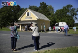 Tourists photograph the Bucktown Village Store, a rural store building that has been restored on the spot believed to be where Harriet Tubman refused a slave owner's orders to help him detain a fellow slave, in Bucktown, Md. It was Tubman's first known ac
