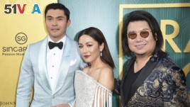 Henry Golding, from left, Constance Wu and executive producer/author Kevin Kwon arrive at the premiere of 