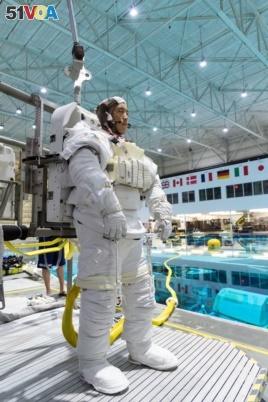 In this November 7, 2018, photo, 2017 astronaut candidate Jonny Kim prepares for underwater spacewalk training at NASA Johnson Space Center's Neutral Buoyancy Laboratory in Houston. Photo Credit: (NASA/Robert Markowitz)