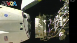 In this image taken from NASA Television, SpaceX's swanky new crew capsule undocks from the International Space Station Friday, March 8, 2019. (NASA TV via AP)