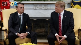 President Donald Trump speaks during a meeting with Brazilian President Jair Bolsonaro in the Oval Office of the White House, March 19, 2019, in Washington. 