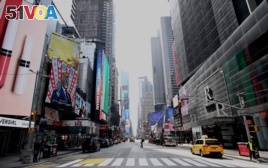 An almost empty street is seen at Times Square in New York City. The city was under a lockdown order on March 16, 2020.