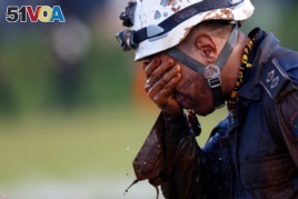 A member of rescue team reacts, upon returning from the mission, after a tailings dam owned by Brazilian mining company Vale SA collapsed, in Brumadinho, Brazil January 27, 2019.