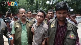 Members of Bangladesh Police Detective Branch escort Sumon Hossain Patwari in Dhaka, Bangladesh, Thursday, June 16, 2016. Police counter-terrorism chief Monirul Islam told reporters that Hossain is charged with taking part in the October attack on publisher Ahmed Rashid Tutul who worked on books by a prominent atheist writer who was killed in a separate attack. (AP Photo)