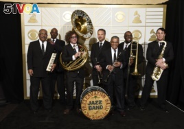 The Preservation Hall Jazz Band poses in the press room at the 58th annual Grammy Awards in Los Angeles, on Feb. 15, 2016.