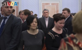 Members of Jehovah's Witnesses react in a court room after a judge's decision in Moscow, April 20, 2017. Russia's Supreme Court has banned the Jehovah's Witnesses from operating in the country.