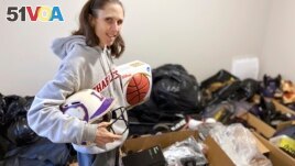 Goods4Greatness, the nonprofit started by Rhiannon Potkey, works to get much-needed gear to low-income children and teens to make sure the high cost of equipment doesn't stop their athletic dreams. (AP Photo/Teresa Walker)