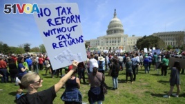 Protesters gather on Capitol Hill in Washington during a Tax Day demonstration calling on President Donald Trump to release his tax returns, April 15, 2017.