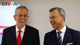 Austrian presidential candidates Alexander Van der Bellen (left), who is running as an independent, and Norbert Hofer, who represents the far-right, pose for photographers before a TV debate in Vienna, Austria, Dec. 1, 2016.