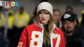 FILE - Taylor Swift wears a Kansas City Chiefs tight end Travis Kelce jacket as she arrives before an NFL wild-card playoff football game between the Chiefs and the Miami Dolphins, Saturday, Jan. 13, 2024, in Kansas City, Mo. (AP Photo/Ed Zurga, File)