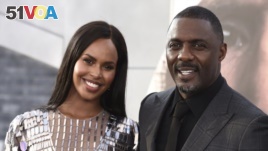 FILE - Idris Elba his wife Sabrina Dhowre Elba are seen here in a July 13, 2019 file photo. Elba says he and his wife had their lives 
