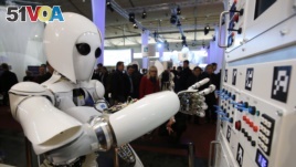 The humanoid robot AILA operates a switchboard during a demonstration by the German research centre for artificial intelligence, Hanover, Germany, March, 5, 2013.