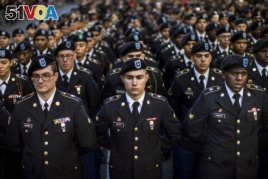FILE - Military personnel march in the annual Veteran's Day parade in New York, Friday, Nov. 11, 2016. (AP Photo/Andres Kudacki)