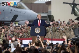 US President Donald Trump speaks to military members and their families stationed in South Korea in Osan Air Base, south of Seoul, Sunday June 30, 2019.