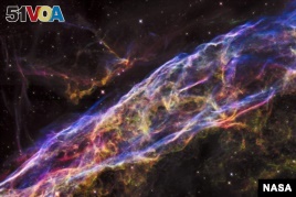 FILE - NASA's Hubble Space Telescope unveiled in stunning detail a small section of the expanding remains of a massive star that exploded about 8,000 years ago.