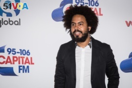 Musician Jillionaire of Major Lazer poses for photographers before performing on stage at the Capital FM Summertime Ball, in London, June 11, 2016.