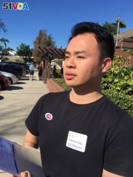 Poll watcher Eddie Hu of the citizen group Asian Americans Advancing Justice keeps track of voting in November, 2016, at a polling station in a heavily Asian-community near Los Angeles.
