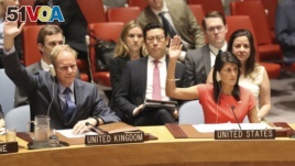 U.S. Ambassador to the United Nations Nikki Haley, right, votes during a Security Council meeting on a new sanctions resolution that would increase economic pressure on North Korea.