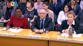 Oxfam's chief executive Mark Goldring, center, Oxfam's international director Winnie Byanyima (left) and Oxfam's chair Caroline Thomson attend a hearing of the British parliament's International Development Committee in London, Britain, Feb. 20, 2018. (REUTERS/Parliament TV handout)