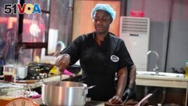 Chef Hilda Baci cooks to establish a new Guinness world record for the longest cooking marathon, the 97-hour cook-a-thon, in Lagos, Nigeria, Thursday, May 11, 2023. (AP Photo/Sunday Alamba)
