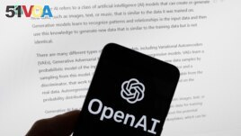 FILE - The OpenAI logo is seen on a mobile phone in front of a computer screen displaying output from ChatGPT, on March 21, 2023, in Boston. (AP Photo/Michael Dwyer, File)