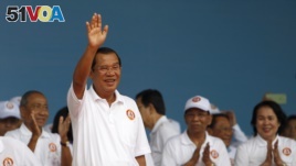 Cambodian Prime Minister Hun Sen waves to supporters during his Cambodian People's Party's campaign in Phnom Penh, Cambodia, Saturday, July 7, 2018. (AP Photo/Heng Sinith)