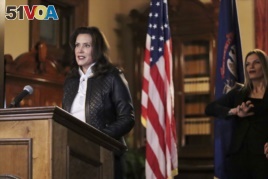 In a photo provided by the Michigan Office of the Governor, Michigan Gov. Gretchen Whitmer addresses the state during a speech in Lansing, Mich., Thursday, Oct. 8, 2020.