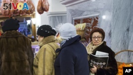 Customers line to stock up for the New Year in GUM Department Store in Red Square in Moscow, Russia, Dec. 29, 2015. Consumer food prices have increased faster than the average rate of inflation: 15.5 percent.