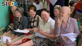 Women living with albinism attend a class at Women and Children with Albinism on the outskirts of Kampala, Uganda, to learn how to make organic soap as a means of earning a living.