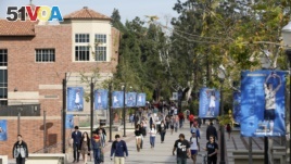 FILE - Students walk on the UCLA campus in Los Angeles, Feb. 26, 2015.