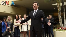 Jimmy Fallon, host of this Sunday's 74th Annual Golden Globe Awards, poses after rolling out the red carpet during Golden Globe Awards Preview Day at the Beverly Hilton on Wednesday, Jan. 4, 2017, in Beverly Hills, Calif.