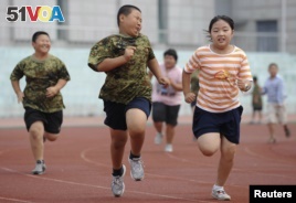 Children exercise during a weight-losing summer camp in Shenyang, Liaoning province, China.