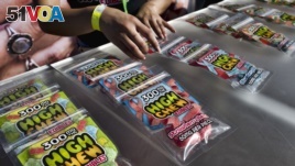 FILE - In this Saturday, Oct. 20, 2018 photo medicated High Chew edibles are shown on display and offered for sale at the cannabis-themed Kushstock Festival at Adelanto, Calif. (AP Photo/Richard Vogel)
