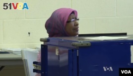 Bangladeshi immigrant Rashida Parveen voted in her first U.S. election in 2000 and now assists as a translator at a Chicago polling site.