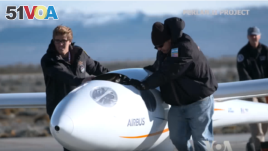 Members of the Perlan II project with the glider.