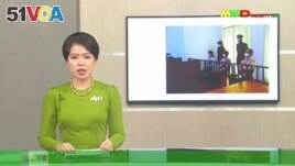 In this image from Myawaddy TV, a photograph of deposed Myanmar leader Aung San Suu Kyi's court appearance was shown during a report about her case is read by a news presenter Monday, May 24, 2021, in Naypyitaw, Myanmar. (Myawaddy TV via AP)