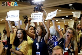 Protesters yell as DNC Chairwoman, Debbie Wasserman Schultz, D-Fla., arrives for a Florida delegation breakfast, Monday, July 25, 2016, in Philadelphia, during the first day of the Democratic National Convention. (AP Photo/Matt Slocum)