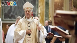 FILE - Cardinal Donald Wuerl, Archbishop of Washington, enters church for Mass at St. Mathews Cathedral, Wednesday, Aug. 15, 2018 in Washington. (AP Photo/Kevin Wolf)