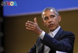 United States former President Barack Obama talks during the 